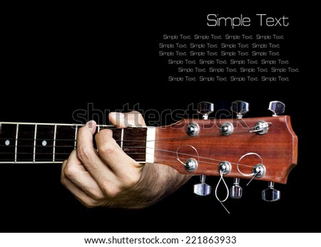 Hand catching guitar.Provide an example for the guitar chords.Finger press down on frets. Isolate background.with text area.