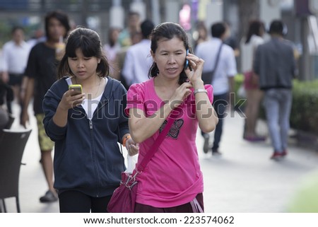 BANGKOK,THAILAND-OCTOBER 2014: Mobile phone and Tablet is essential for every day life in Bangkok same another city  all over the world.