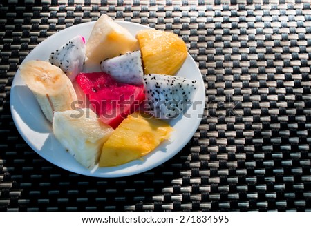 Fruit set on table with sunshine light at early morning.