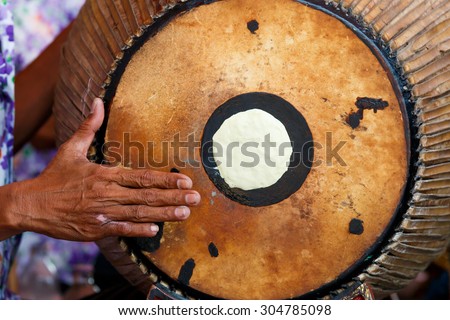 Close up hand and percussion drum in thai orchestra band.