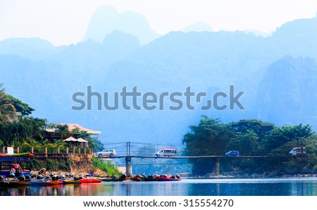 VANG VIENG, LAOS- 18 APRIL 2015 : Waterfront at end point rafting in Song River, Vang Vieng, Laos, Rafting with kayak and tubing are famous and do not miss enjoy.