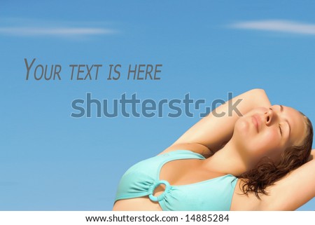 Young woman sunbathe, with free space for your text