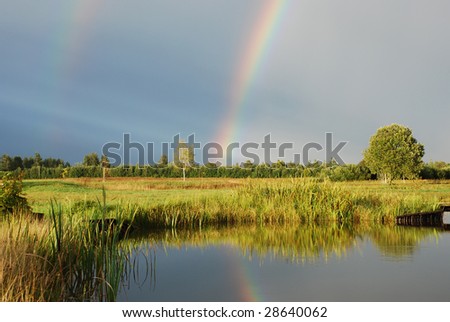 Rainbow with reflection on the water