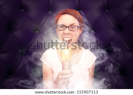 Very angry woman with glowing mic / radio moderator