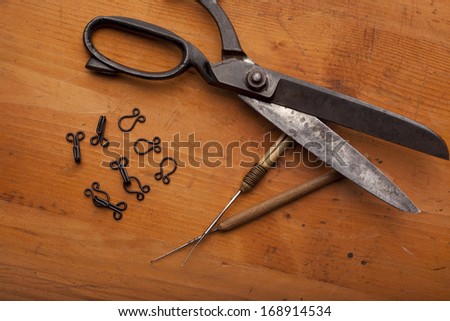 dressmaker shears craft concept with crochet on wooden texture