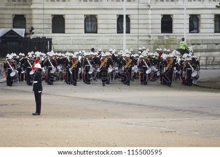 LONDON-JUNE 7: The Massed Bands of her Majesty\'s Royal Marines perform at Horseguards Parade to mark the 91st birthday of His Royal Highness The Duke of Edinburgh on June 7, 2012 in London.