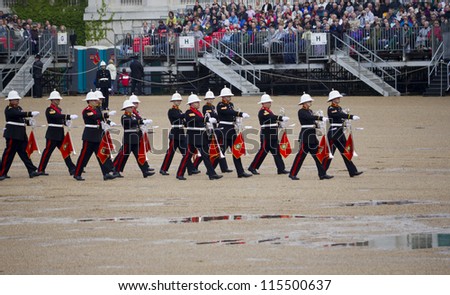 LONDON-JUNE 7: The Massed Bands of her Majesty\'s Royal Marines perform at Horseguards Parade to mark the 91st birthday of His Royal Highness The Duke of Edinburgh on June 7, 2012 in London.