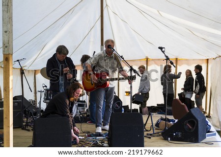 NORTHUMBERLAND, ENGLAND, AUGUST 30, 2014. Singer, songwriter, Steve Daggett, original member of band, Lindisfarne, performs at fund raising event. August 30, 2014, Northumberland, England, UK.