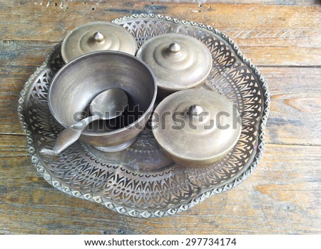 Old brass tray or suit of food wares