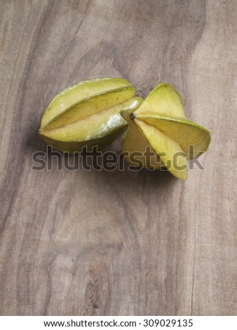 star apple or star fruit on wood background