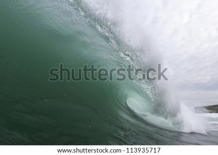 Green Wave/ an excellent shaped wave pitches and tubes, shot from the water, inside the wave