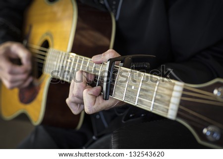 Guitar playing/close up of a country western guitarist