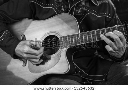Guitar playing/close up of a country western guitarist