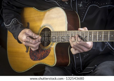 Guitar playing/close up of a country western guitarist