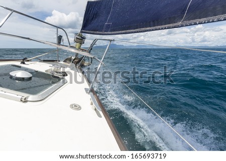 keeled over/ at the bow of a sailing yacht in trim and keeled over showing that it is sailing well and fast