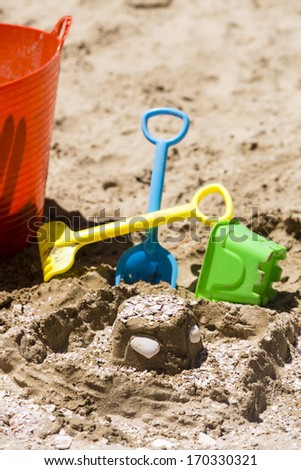 Sand Castle Toys/ a child\'s sand castle toys on the beach