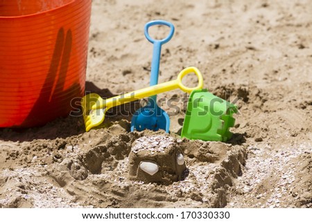 Sand Castle Toys/ a child\'s sand castle toys on the beach