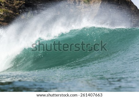 Wave Tubing/ a perfect wave tubing at Piha Beach, Auckland, New Zealand
