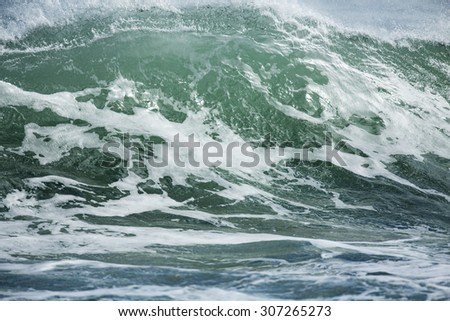 Shore Break Surf/ a full frame image of a shore break or shore dump breaking