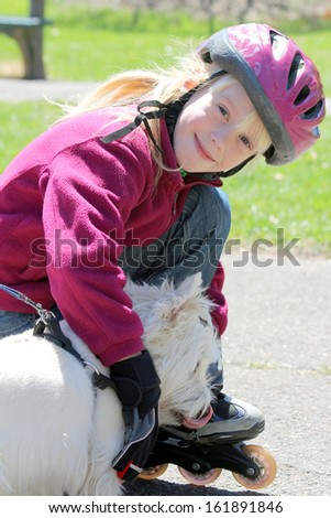 Pretty little girl with her cute little dog