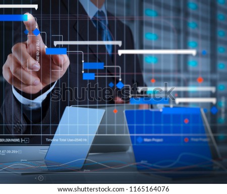 Project manager working and update tasks with milestones progress planning and Gantt chart scheduling virtual diagram.businessman hand pressing a touchscreen button on server background.