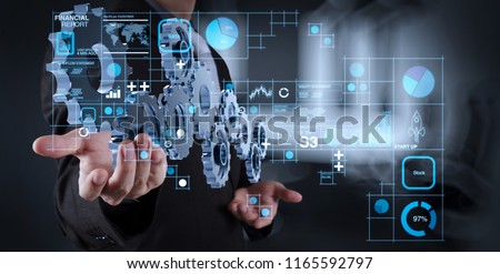 Financial report data of business operations (balance sheet and income statement and diagram) as Fintech concept.businessman hand showing gear to success concept as concept
