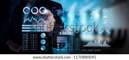 Investor analyzing stock market report and financial dashboard with business intelligence (BI), with key performance indicators (KPI).businessman hand working with finances program on wide screen