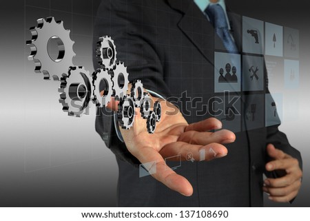 businessman hand draws gear to success as concept