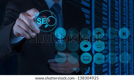 businessman hand showing search engine optimization SEO as concept