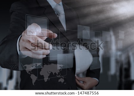 engineer hand pushing on a touch screen interface