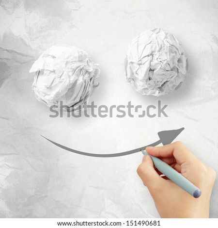 Hand draw smile face arrow and crumpled paper texture as concept
