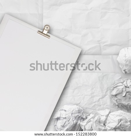 composition of white crumpled paper background texture and blank book