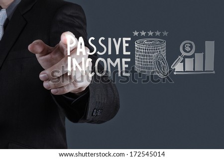 businessman hand pointing  passive income touch screen computer as concept