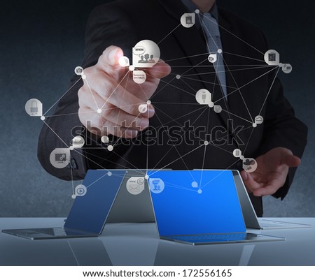 businessman working with new modern computer show hand drawn social network structure