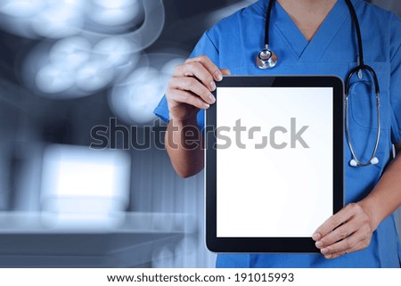 Doctor working with tablet computer with operating room Doctor working with tablet computer with operating room