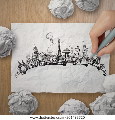 crumpled paper with hand drawn traveling around the world on wooden background as concept