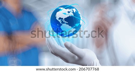 Medical Doctor holding a world globe in her hands as medical network concept Medical Doctor holding a world globe in her hands as medical network concept