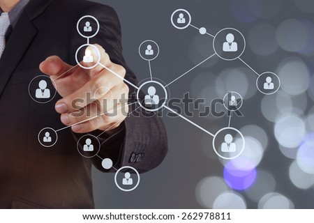 businessman hand showing human icon flow chart on new modern computer as concept with bokeh exposure