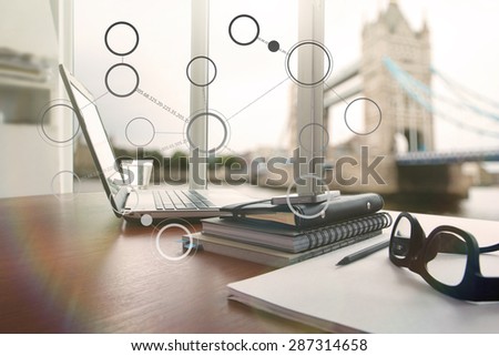 laptop computer is on wooden desk as workplace concept with overcast effect with social media diagram