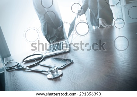 team doctor working with laptop computer in medical workspace office and medical network media diagram as concept