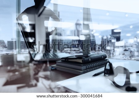 double exposure of business documents on office table with smart phone and digital tablet and london city blurred view and man thinking in the background