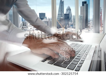 Double exposure of business engineer draw icon of industry and london city as concept