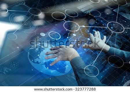 top view of businessman hand working with modern technology and digital layer effect as business strategy concept