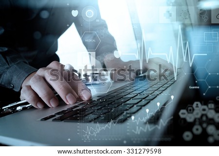 Doctor working at workspace with laptop computer and medical digital network media diagram in medical workspace office