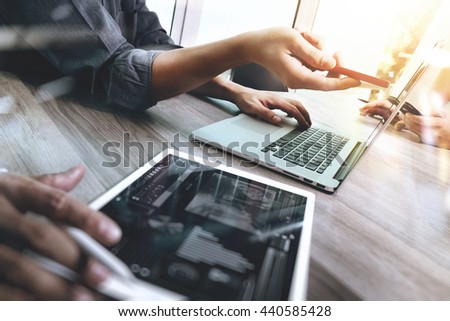 Business team meeting present. Photo professional investor working with new startup project. Finance managers task.Digital tablet laptop computer design smart phone using, Sun flare effect