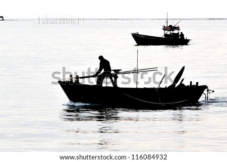 Silhouette of fishing boat
