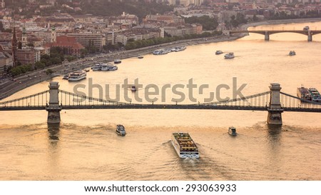 Sightseeing boat tour cruise Danube river under Chain bridge, Budapest