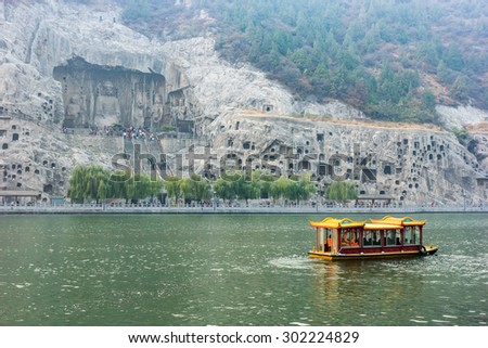 Boat Tour cruise at The Longmen Caves (Longmen Grottoes) along the Yi River near Luoyang in Henan Province
