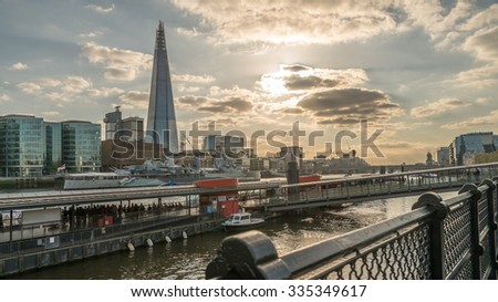 London City, Beautiful Panorama View of The Shard of London, Tower Millennium Pier and London City Skyline across Thames River under Dramatic Golden Sky Sunset in Summer, England, UK
