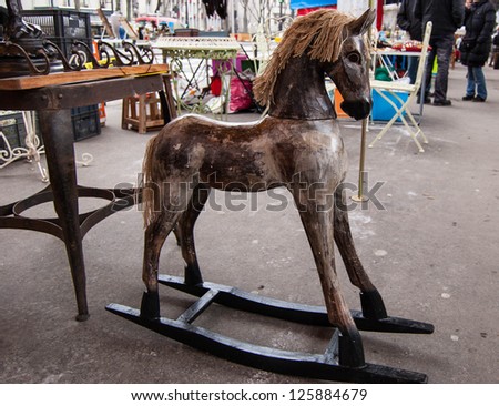 Vintage rocking horse at flea market in Paris.
